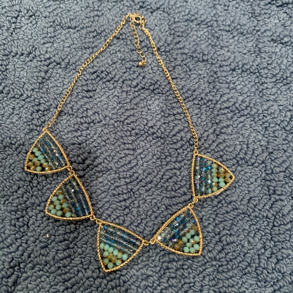 Gold necklace with blue beaded detail